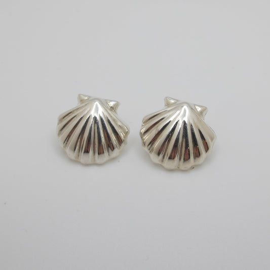 Silver shell earrings on a white background
