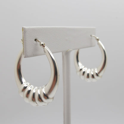 Silver hoop earrings on a white background